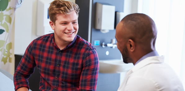 Employee speaking with supervisor representing worker injury and compensation support