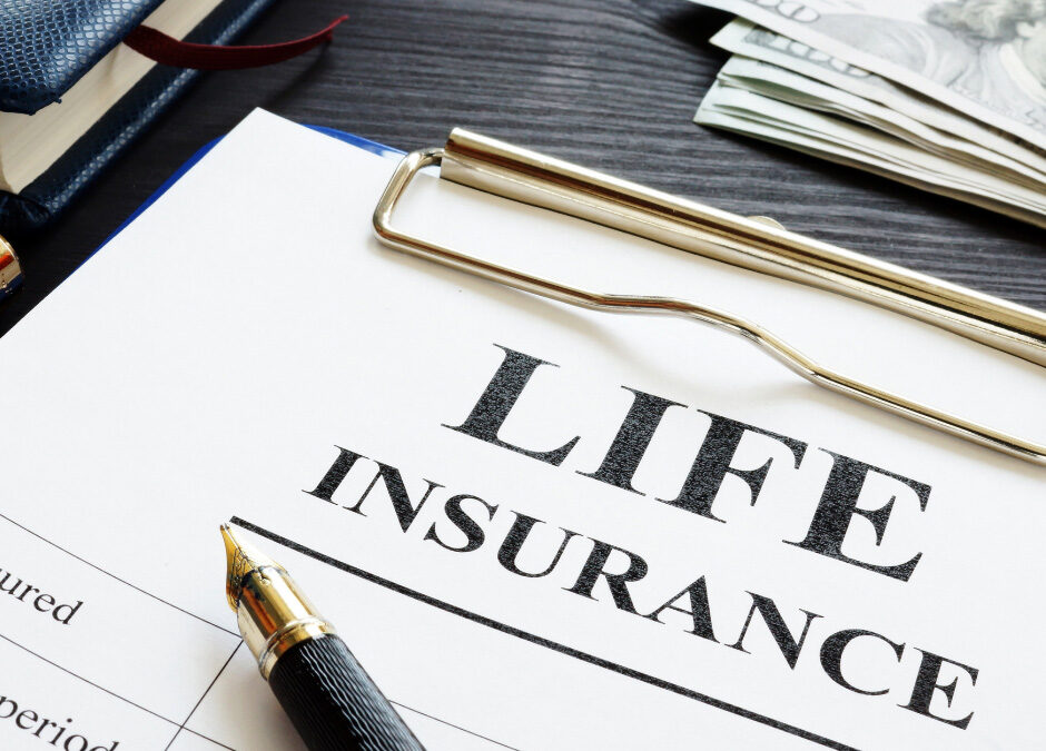 Life insurance policy document with a pen, money, and financial paperwork.
